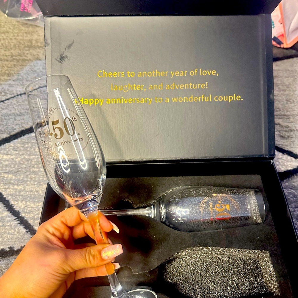 50th anniversary champagne glasses. Brand new. Amazing display box.